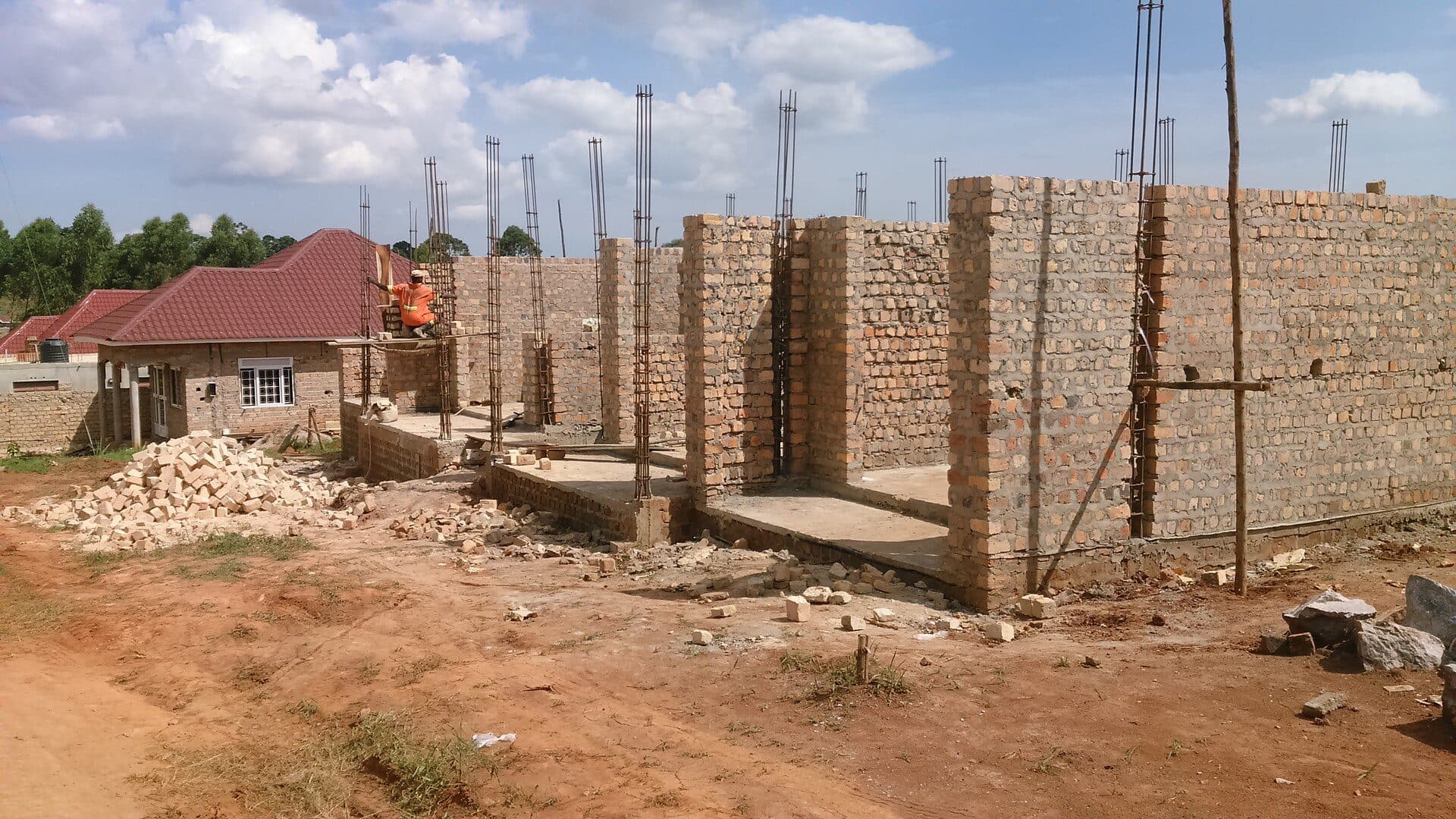 House under construction with brick walls